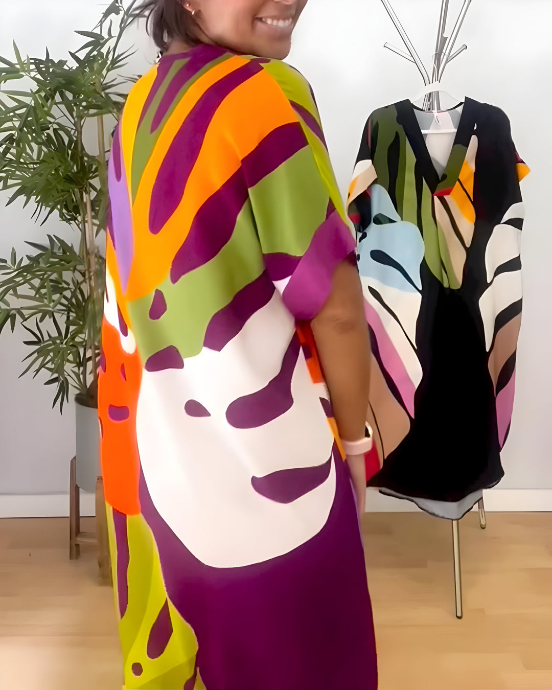 Women's casual abstract print V-neck shift dress. Short sleeve, relaxed fit, and vibrant, great for everyday fashion.
