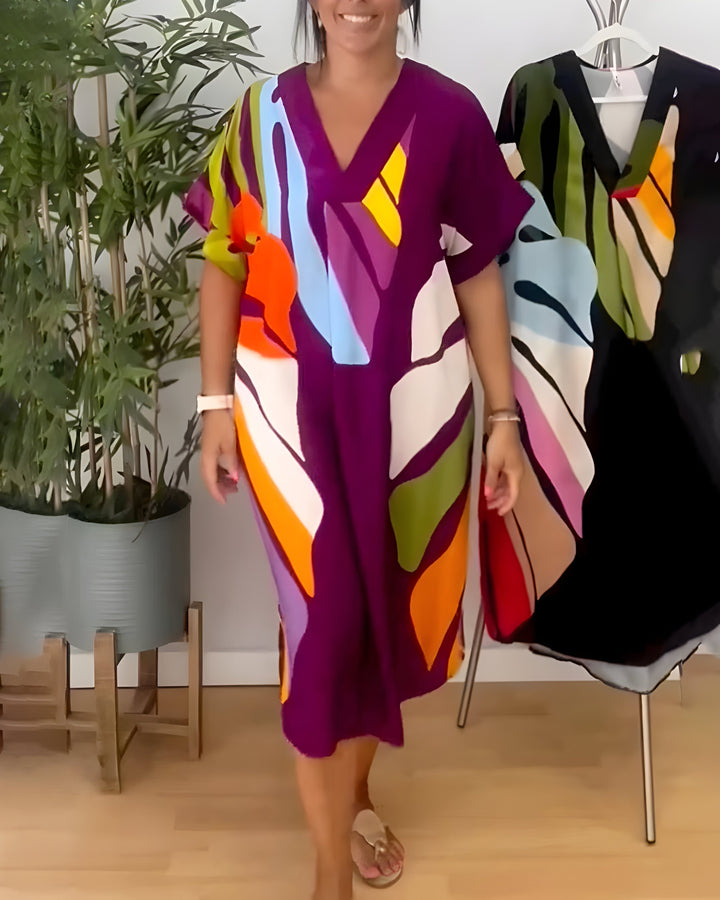 Trendy women's abstract print V-neck shift dress. Short sleeve, relaxed fit, and vibrant, perfect for summer days.