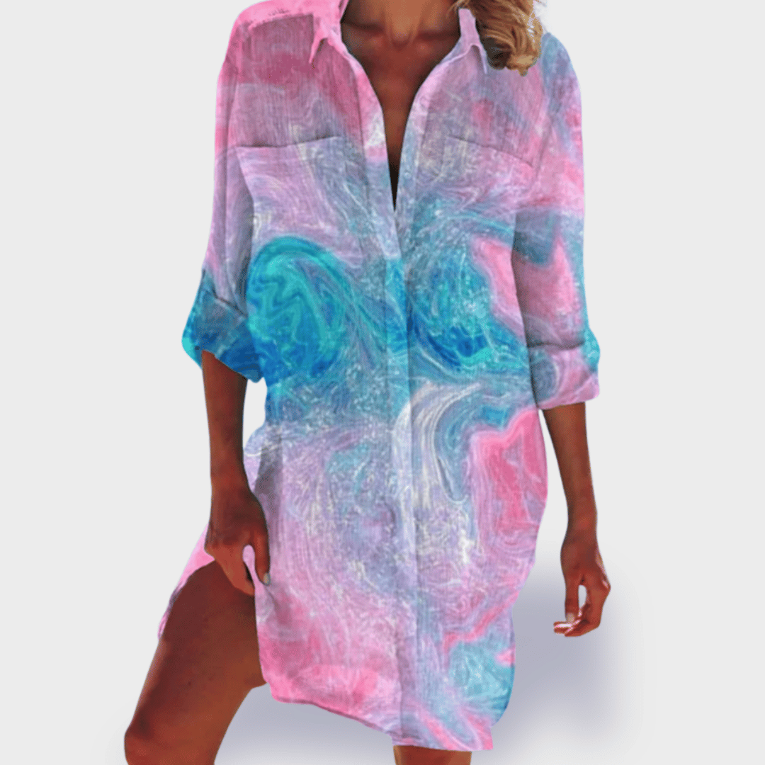 Colorful women's draped flowy dress with a vibrant design. Perfect for effortless casual or elegant wear.