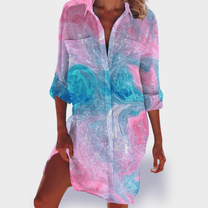Colorful women's draped flowy dress with a vibrant design. Perfect for effortless casual or elegant wear.