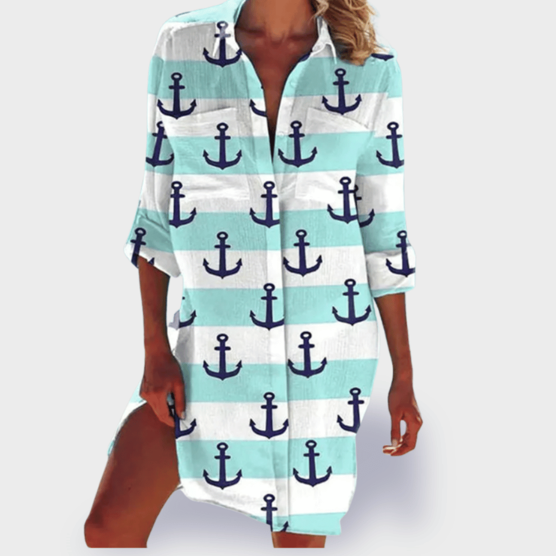 Flowy women's draped dress in a vibrant print, offering comfortable and effortless summer style.