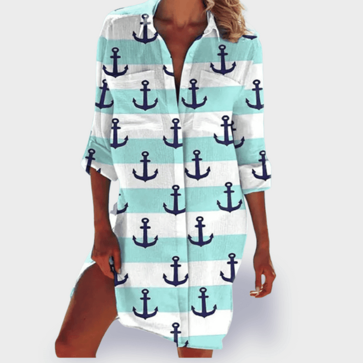 Flowy women's draped dress in a vibrant print, offering comfortable and effortless summer style.