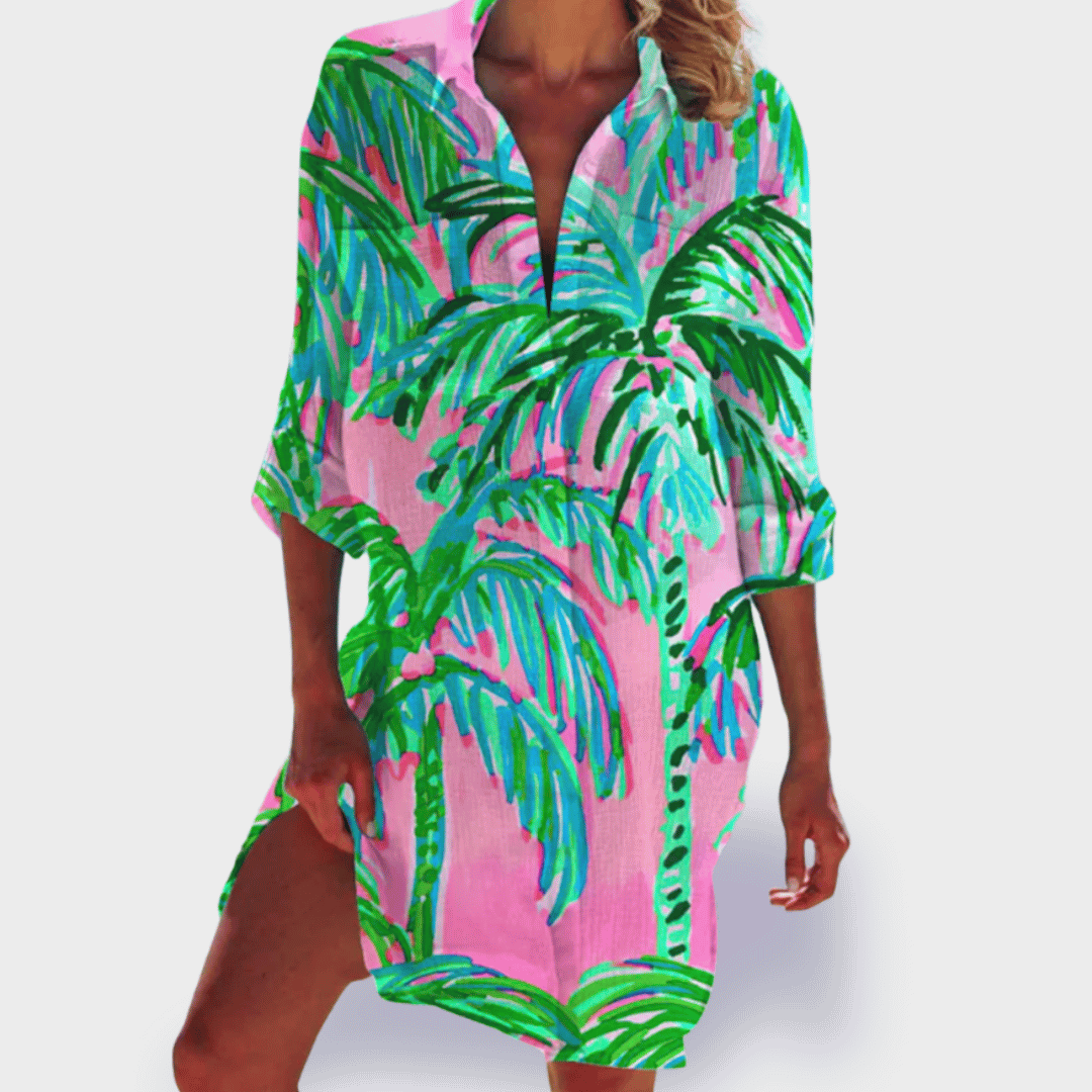 Flattering vibrant women's flowy draped dress. Comfortable, colorful, and perfect for summer elegance.
