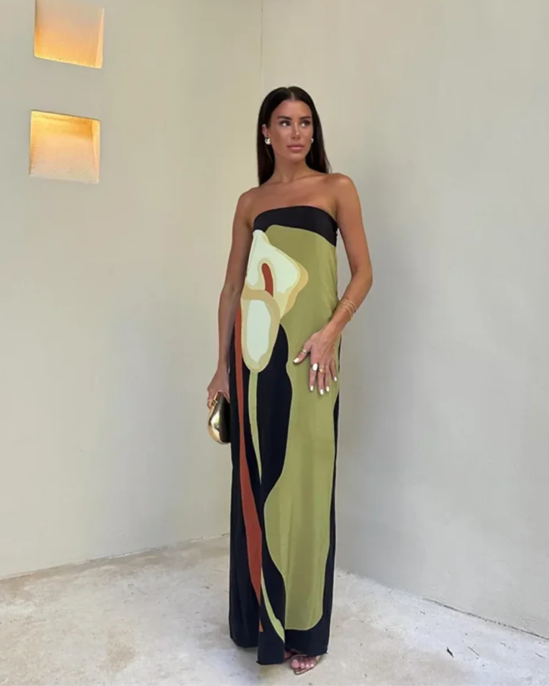 Vibrant women's maxi dress, perfect for summer holidays and beach days. Features a beautiful bold print.