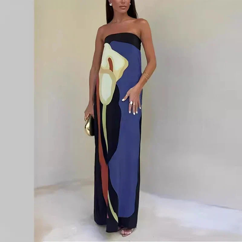 Stylish women's summer maxi dress with a bold print, an off-shoulder, flowy design for vibrant holiday vibes.