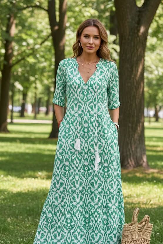 Colorful women's long flowy maxi dress, vibrant summer design, perfect for casual elegance and vacation.