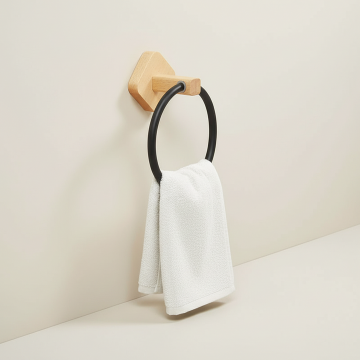Modern wall-mounted towel ring, combining wood and aluminum, enhances bathroom home organization.