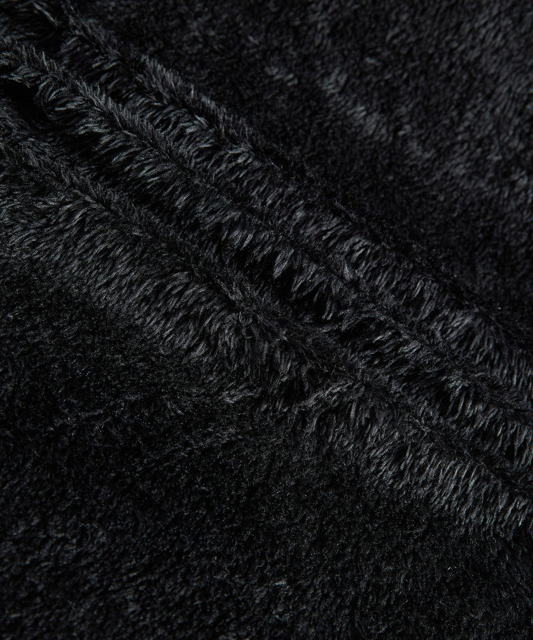 Black insulated men's winter jacket, sherpa-lined, designed for ultimate warmth and durability
