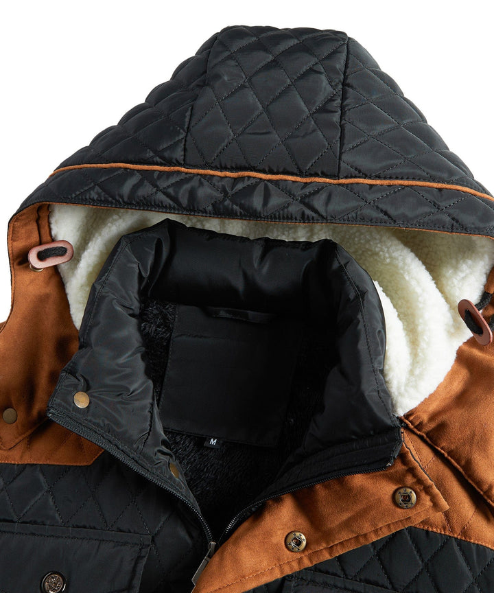 Man wearing a black insulated sherpa-lined winter jacket, casual outdoor style, full body shot