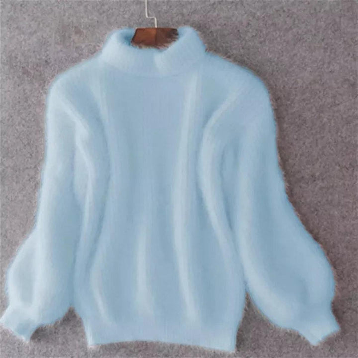 Warm women's high neck knit sweater in a cozy, elegant cream color, perfect for winter fashion.