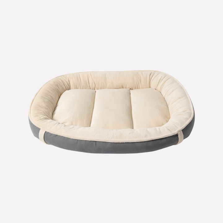 Comfortable dog bed with removable washable cover & non-slip base. Plush nest design for cozy pet comfort.