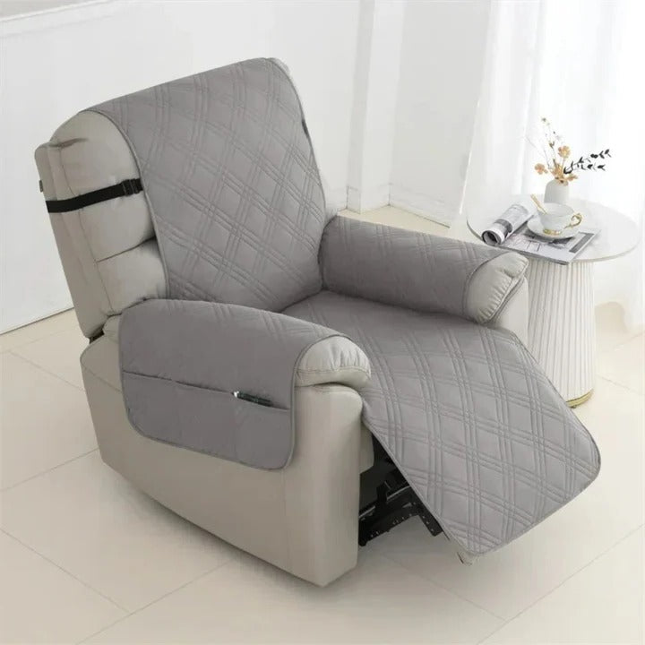 Stylish quilted recliner cover in a neutral tone, featuring waterproof fabric and secure non-slip straps for comfort.