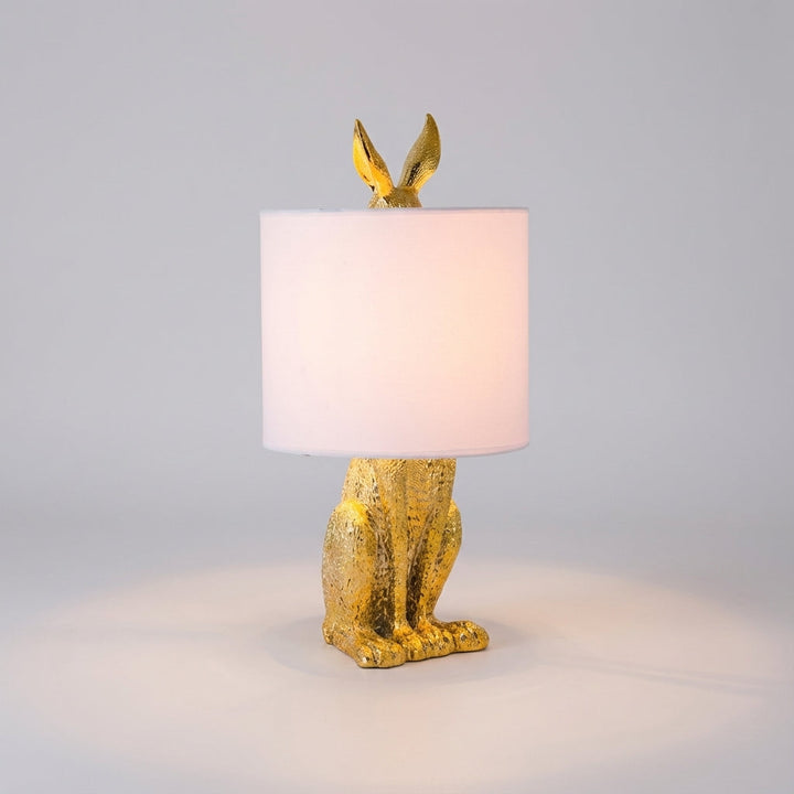 Noctebelle masked animal table lamp. Sculptural light provides ambient glow for living room & modern decor.