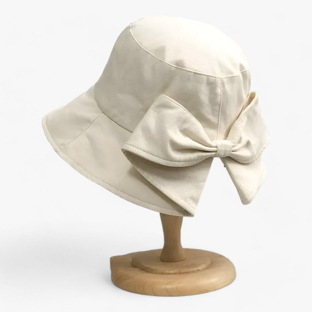 Breathable white cotton women's sun hat, offers UV protection for outdoor summer activities.