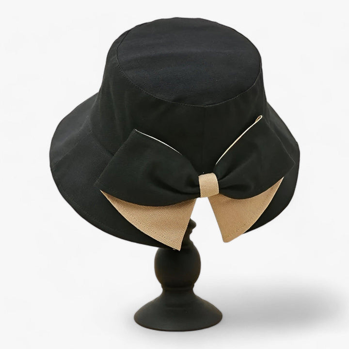 Lightweight women's travel sun hat, white cotton, offers UV protection & breathability.
