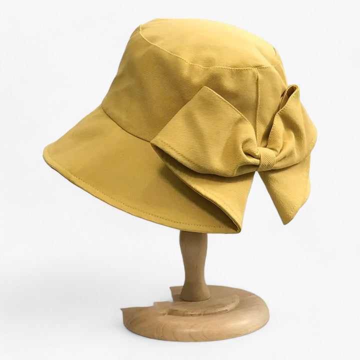 Women's UV protection sun hat, white cotton, breathable, perfect for outdoor summer.