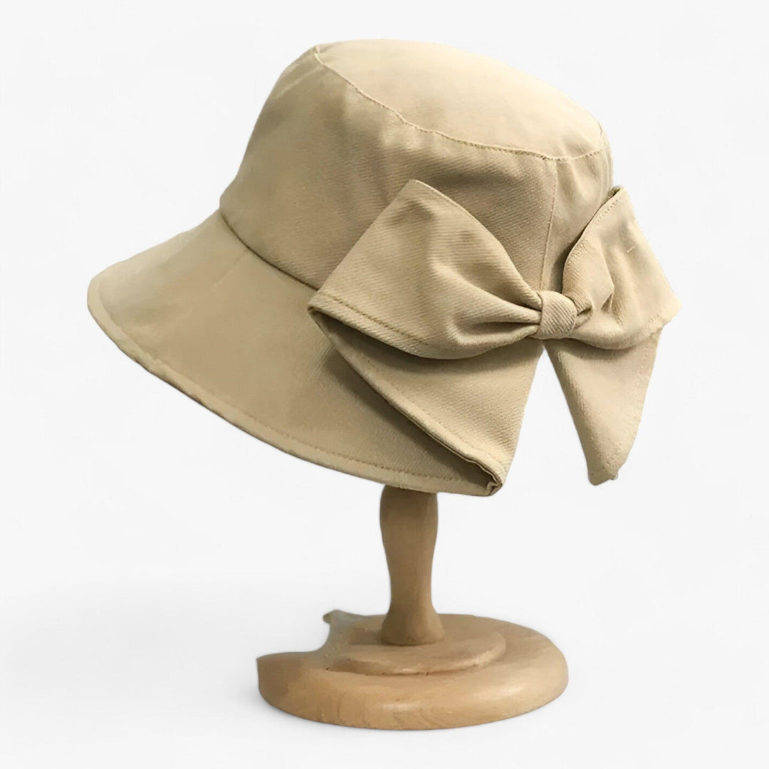 White cotton women's breathable sun hat, great for beach, travel, and outdoor wear.
