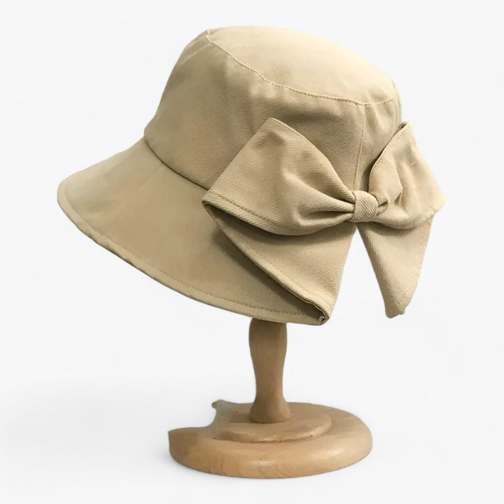 White cotton women's breathable sun hat, great for beach, travel, and outdoor wear.