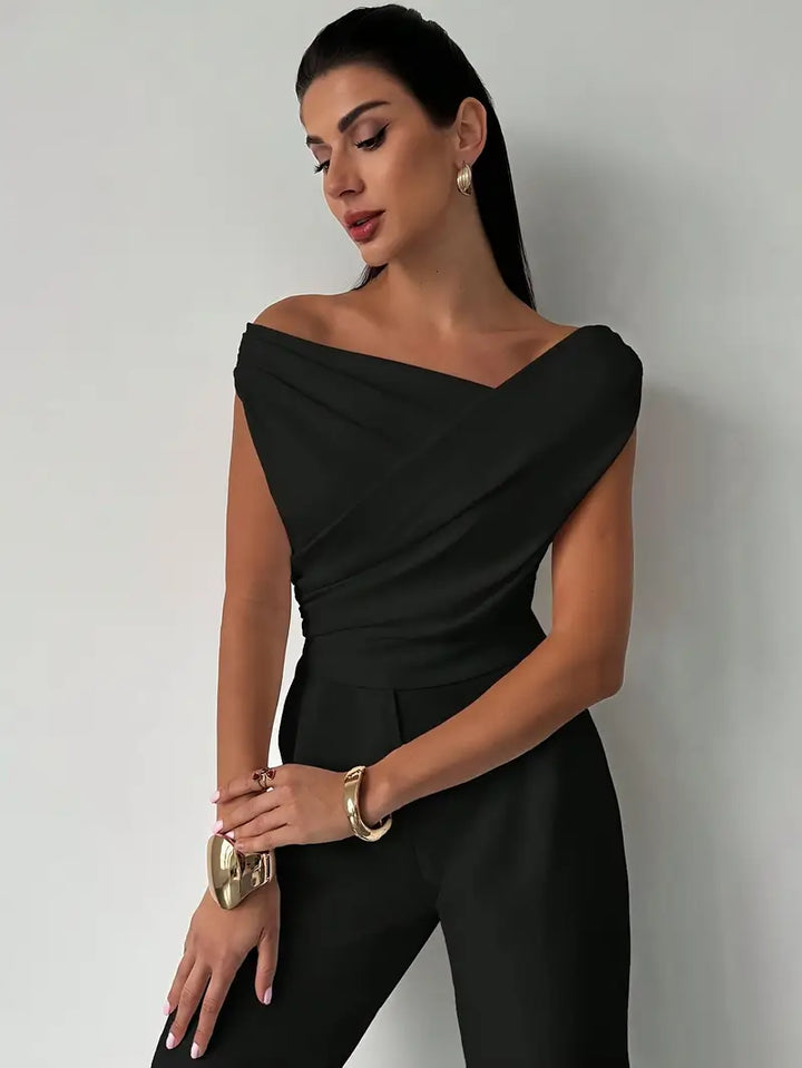 Draped shoulder black top for women, providing an elegant and sophisticated look.