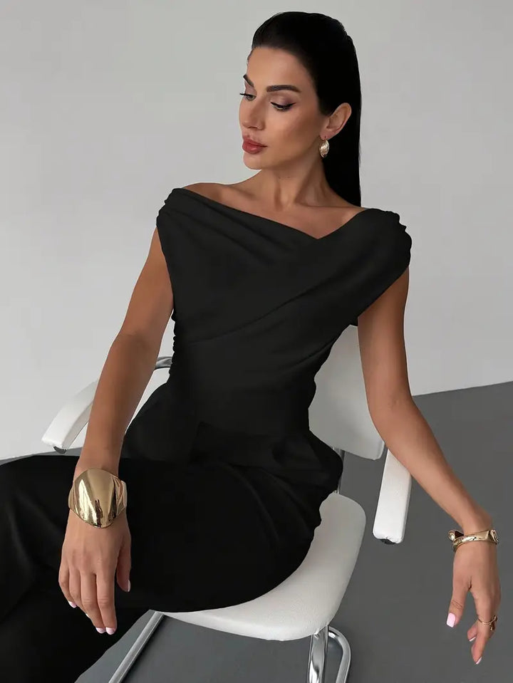 Sophisticated draped shoulder top for women in black, great for smart casual outfits.