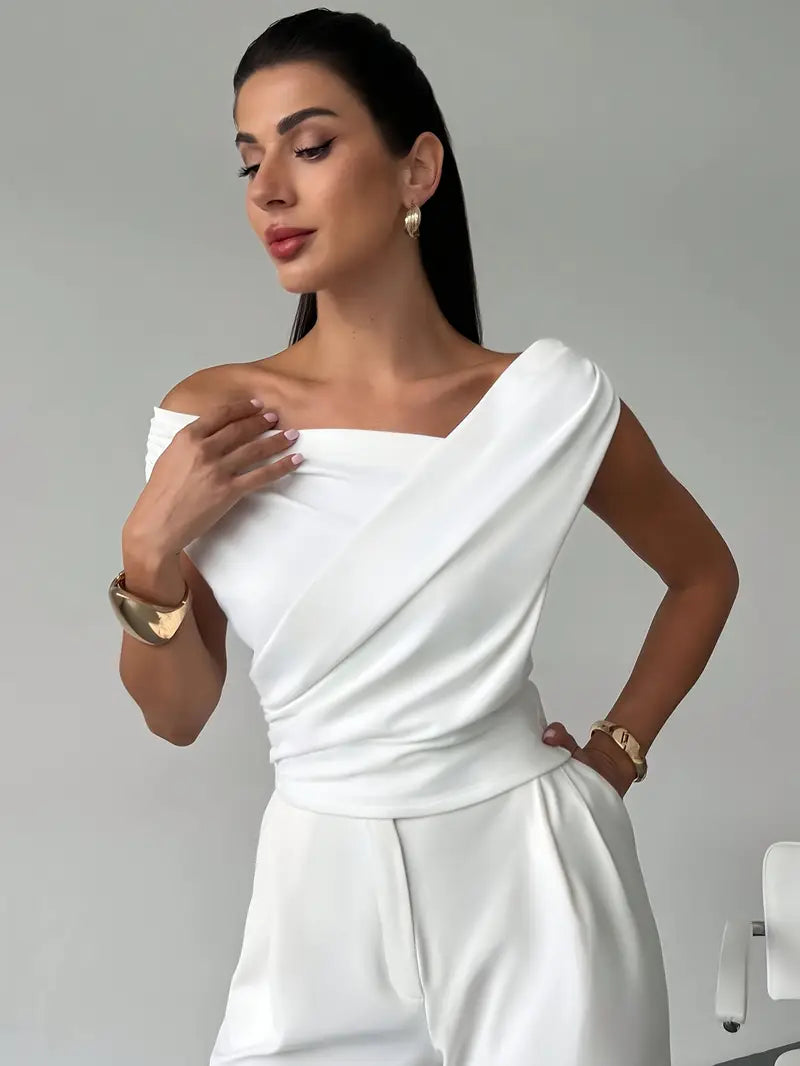 Elegant black blouse with a stylish draped shoulder, a versatile fashion top for women.