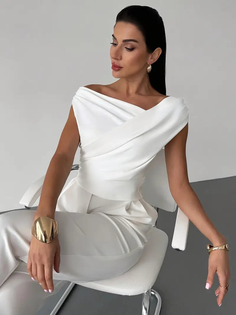 Chic red women's top featuring a unique draped shoulder design, smart casual ready.