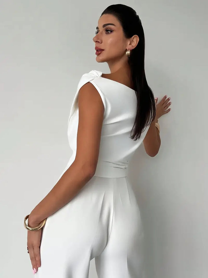 Elegant women's top, white, with a beautiful draped shoulder for a chic silhouette.