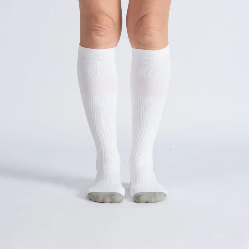 White & gray unisex gentle compression socks, close-up for comfort, support, circulation, athletic