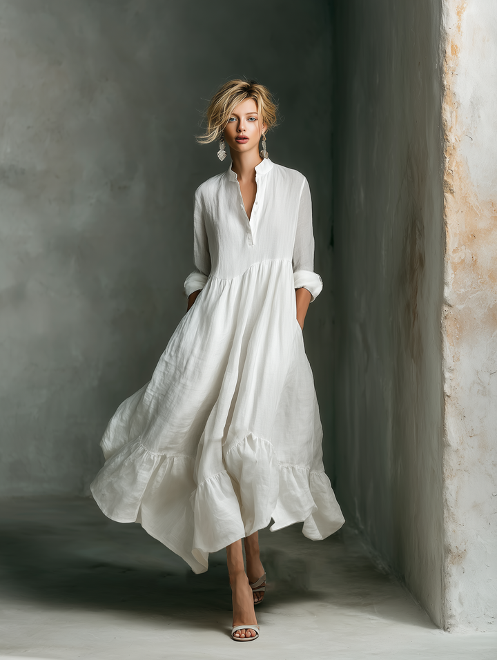Effortless white maxi dress for women, featuring long sleeves & tiered skirt. Ideal for relaxed fit casual summer style.