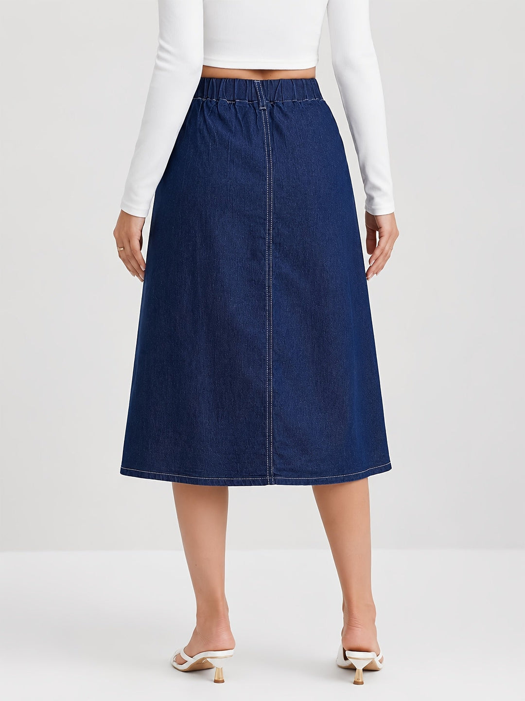 Stylish women's medium blue A-line midi skirt with front buttons, great for everyday fashion & modest looks.