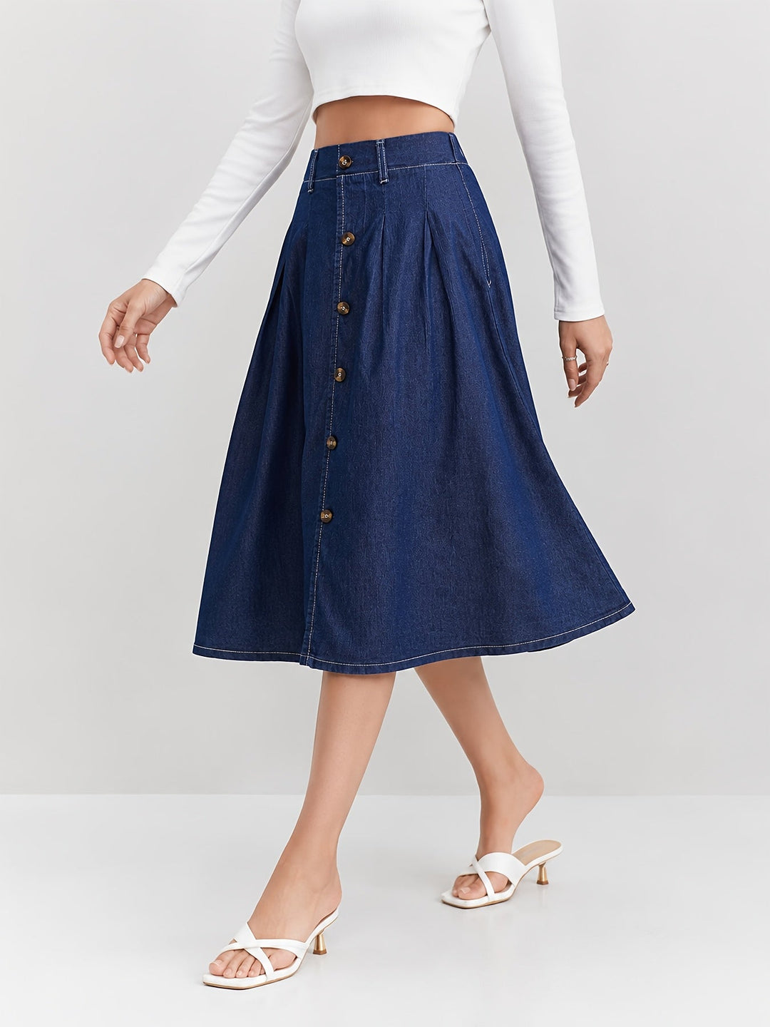 Flattering A-line midi skirt in medium blue for women, with a functional button-front design. Versatile fashion.