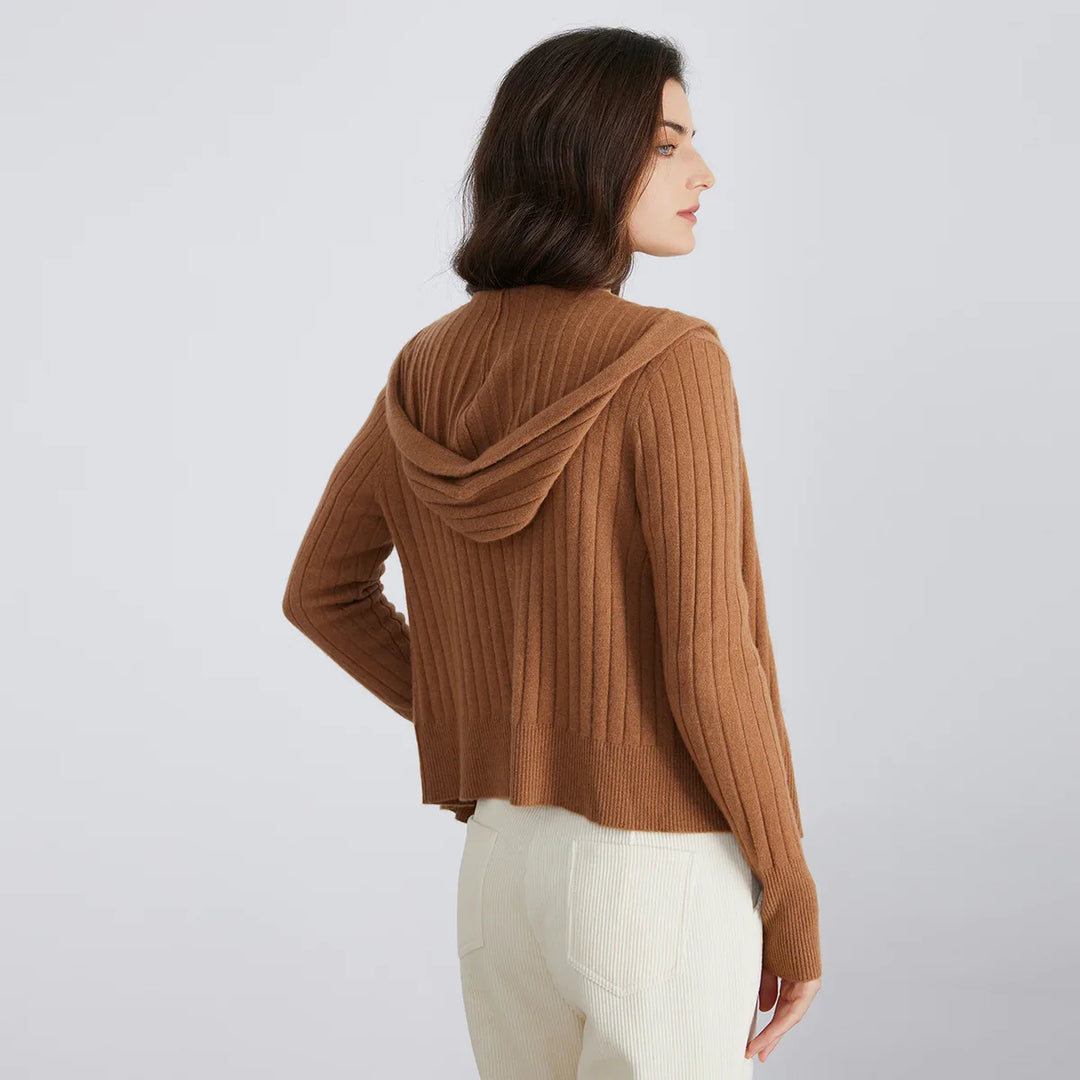 Close-up of the ribbed texture on a women's full-zip hooded cardigan, highlighting quality knit.