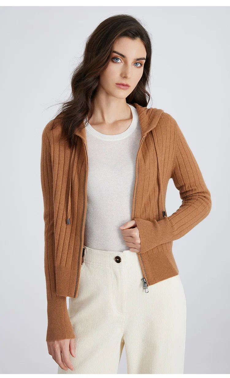 Model smiling, wearing a warm full-zip hooded ribbed knit cardigan, ideal for fall fashion.
