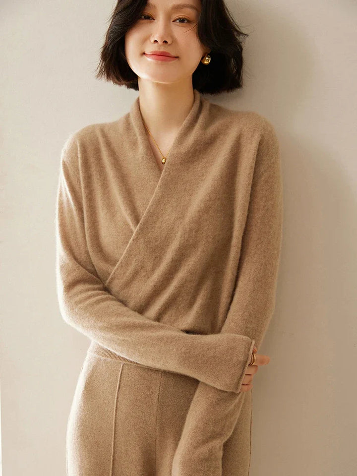 Detail of the knit and crossover on an ivory cashmere sweater