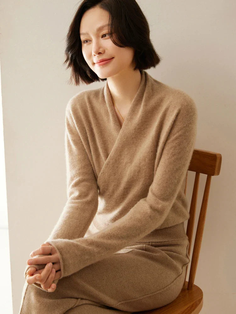 Full shot of a luxurious ivory women's cashmere crossover sweater