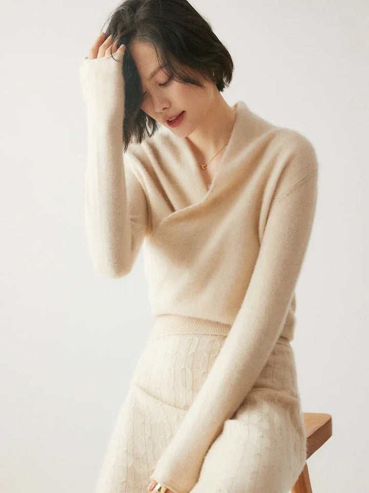 Luxurious pink cashmere women's sweater, draped crossover style