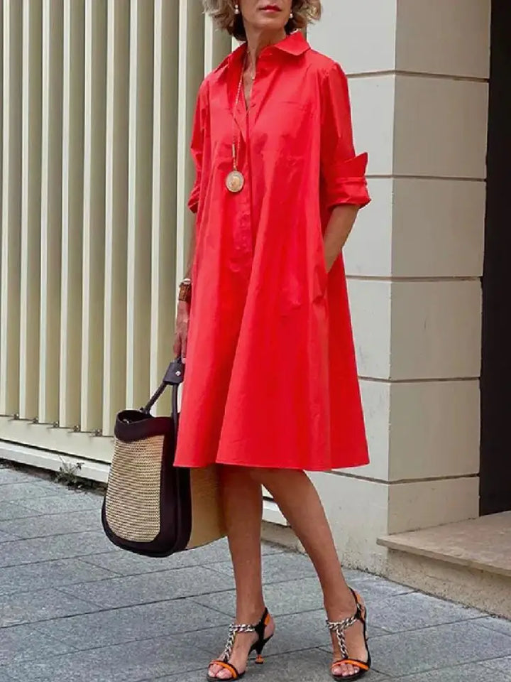 Comfortable women's button-front midi shirt dress. Versatile A-line style, perfect for smart casual or everyday wear.