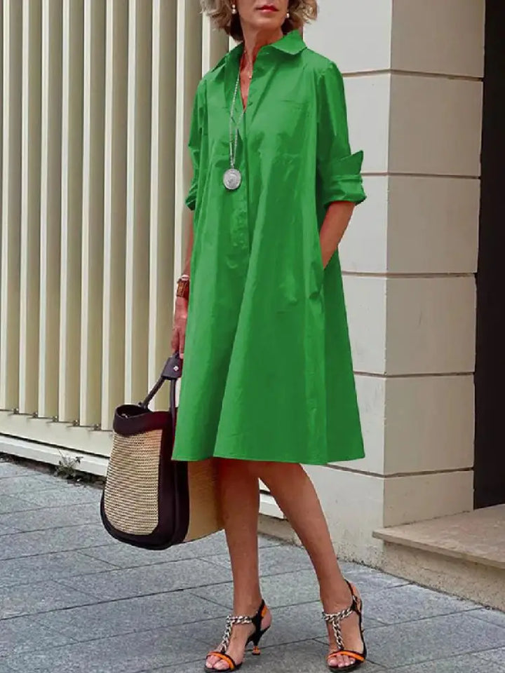 Stylish women's button-front A-line midi dress. Effortlessly chic long-sleeve shirt dress, perfect for any casual occasion.