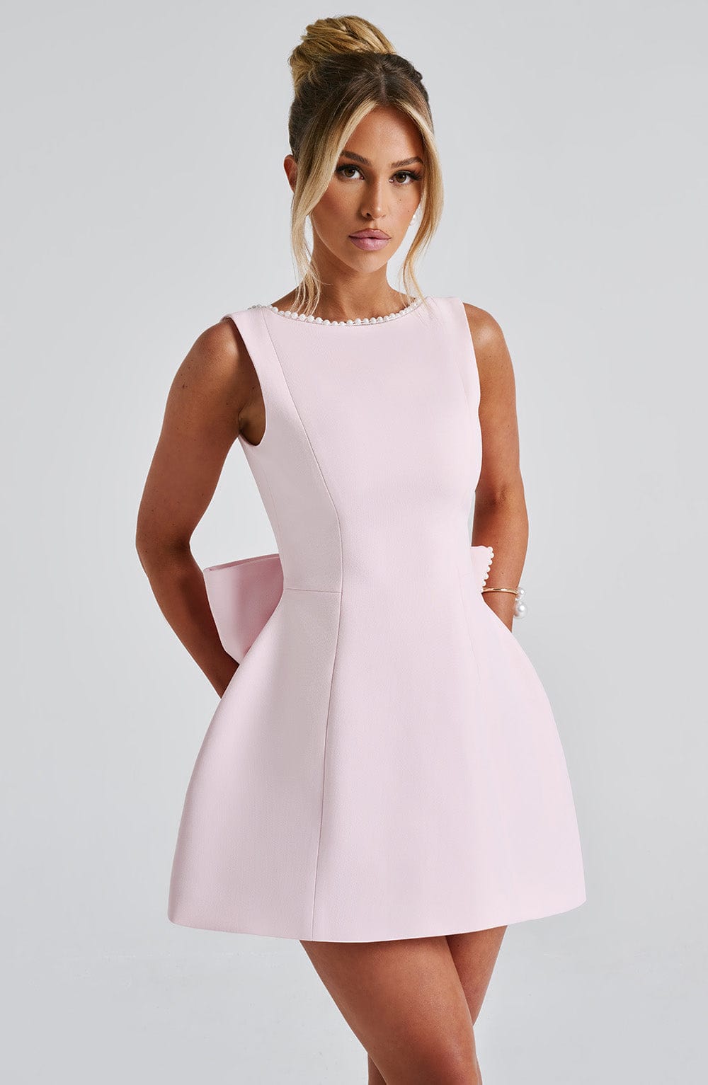 Elegant women's pearl trim A-line mini dress, perfect for homecoming or cocktail parties.