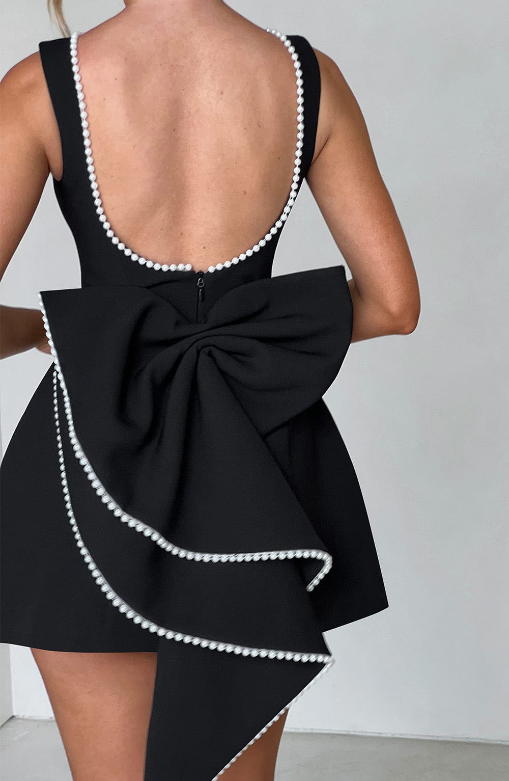 Glamorous women's short A-line party dress with pearl trim, a stunning elegant choice.