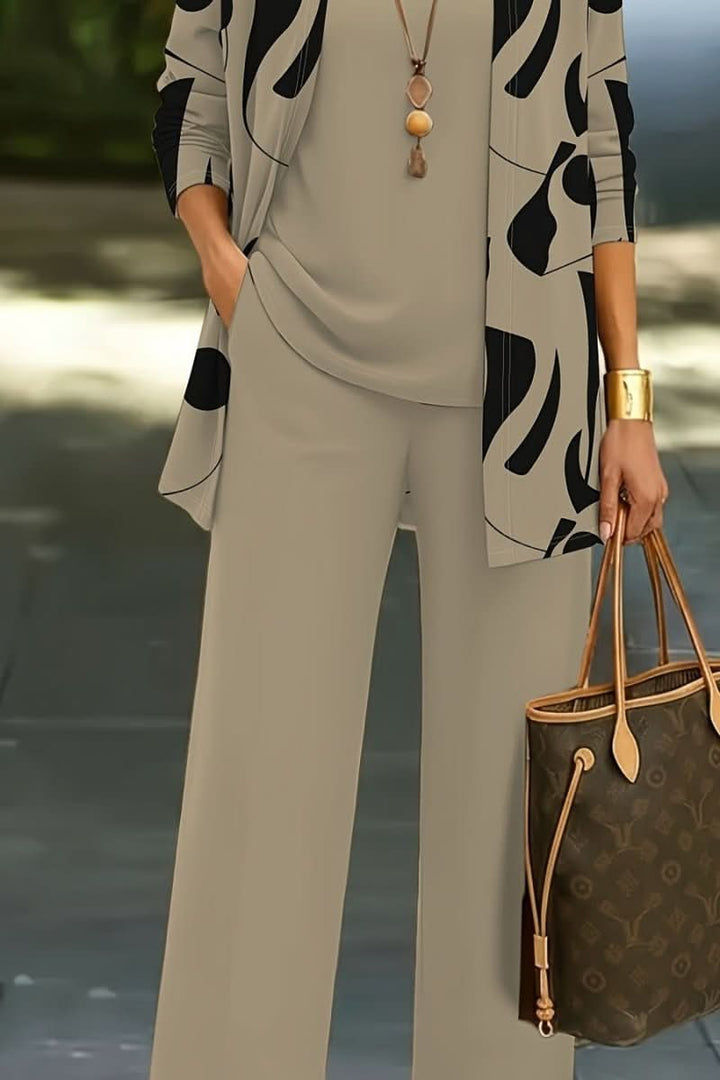 Women's abstract print 3-piece coordinated set for modern, versatile casual wear. Stylish ensemble.