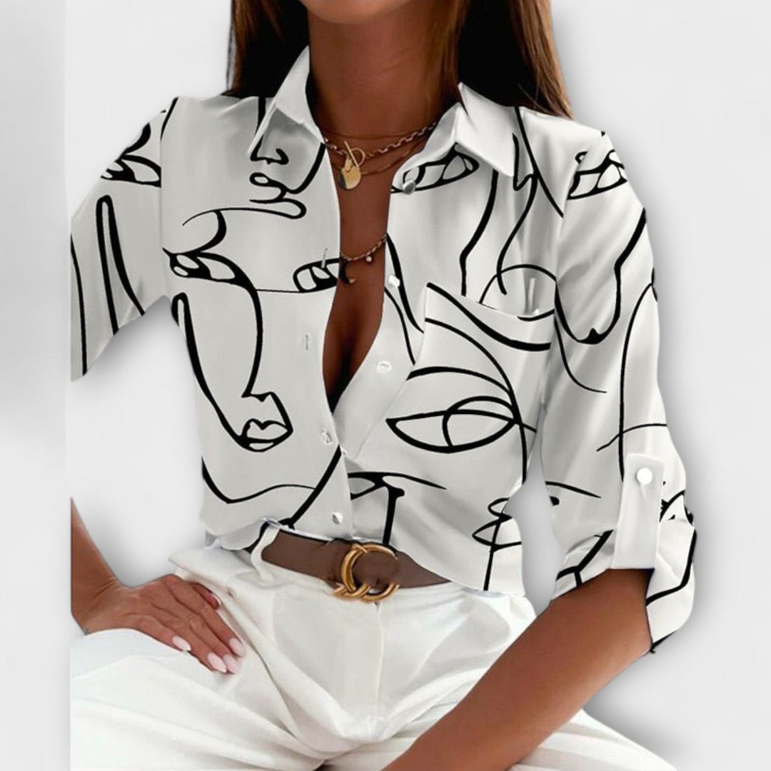 Modern abstract print women's blouse, long sleeve button down for contemporary fashion.