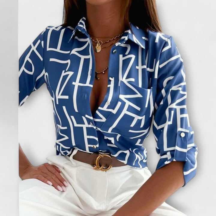 Oversized fit women's button down shirt, abstract print for a fashion-forward statement piece.