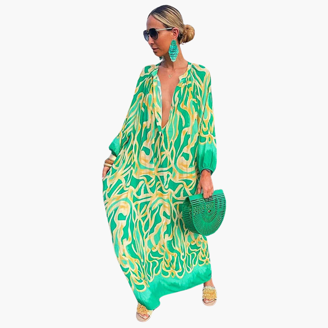 Women's abstract print oversized maxi dress with deep V-neck, perfect for summer beach or resort wear.