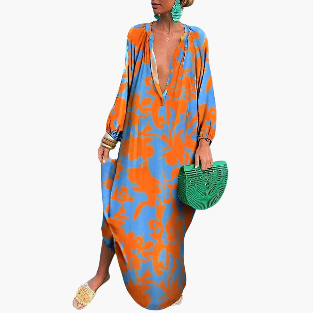 Flowy oversized abstract print maxi dress for women, featuring a deep V-neck, ideal for vacation outfits.