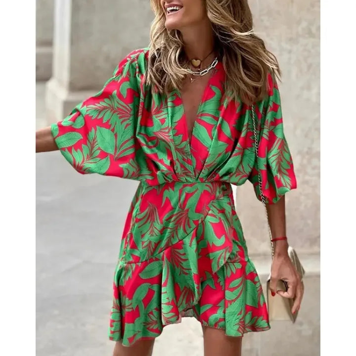 Stylish women's V-neck mini dress with abstract print, ruffles, and wide sleeves for parties or casual outings.