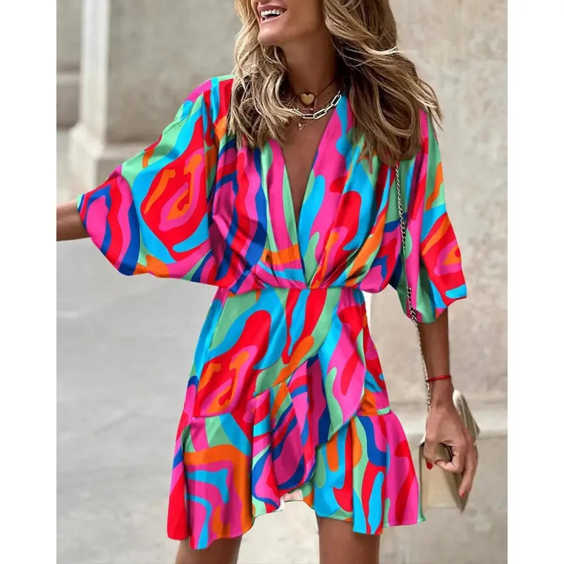 Flattering women's ruffle mini dress with V-neck, wide sleeves, and a vibrant abstract pattern for any occasion.
