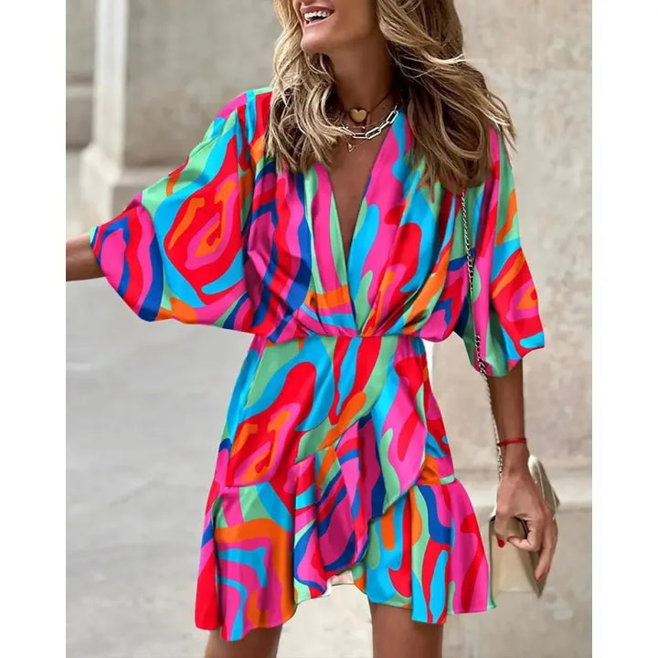 Flattering women's ruffle mini dress with V-neck, wide sleeves, and a vibrant abstract pattern for any occasion.