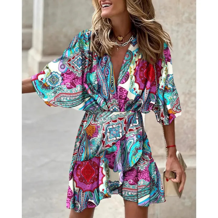 Casual women's V-neck ruffle mini dress with wide sleeves & eye-catching abstract print for comfortable summer style.