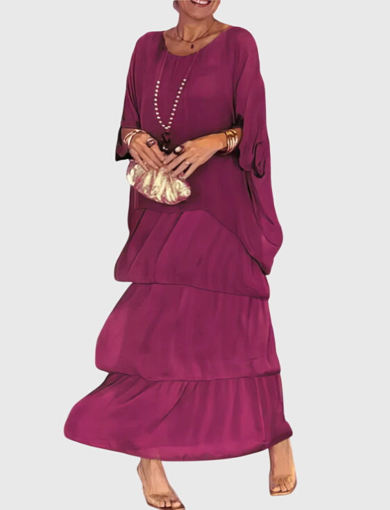 Bohemian flowy maxi dress for women with striking abstract print, embodying effortless summer style.
